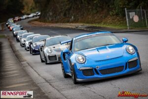 A GT3 RS leads a group of Porsches to Fontana Damn during Rennsport Dragon Rally 2024.